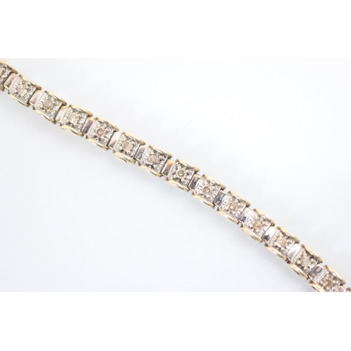 302 - A 9ct two tone diamond set bracelet, the white metal square shaped links set with round cut diamonds... 