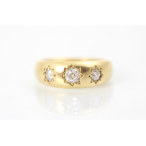 305 - A 20th century yellow metal diamond set gypsy ring, the old cut diamond set to the centre with small... 