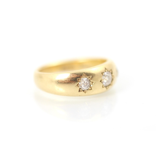 305 - A 20th century yellow metal diamond set gypsy ring, the old cut diamond set to the centre with small... 