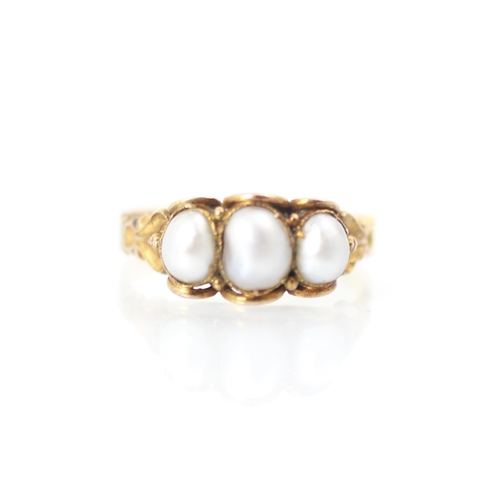 309 - A 19th century untested pearl ring, the three baroque shaped pearls within scalloped yellow metal ed... 