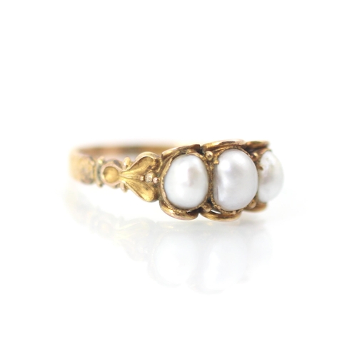 309 - A 19th century untested pearl ring, the three baroque shaped pearls within scalloped yellow metal ed... 