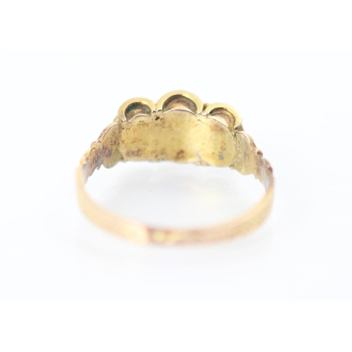 309 - A 19th century untested pearl ring, the three baroque shaped pearls within scalloped yellow metal ed... 