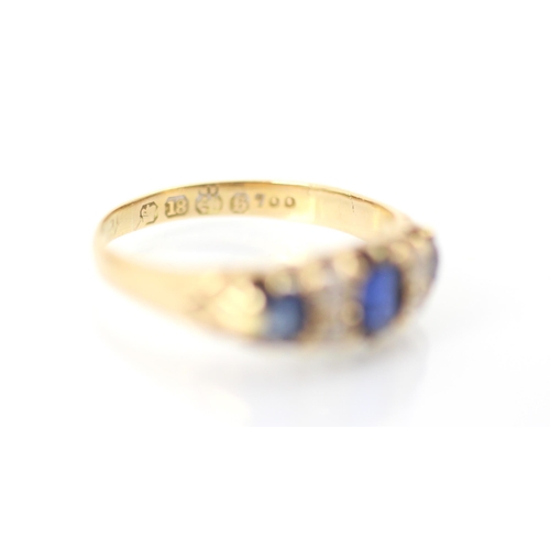 311 - A 19th century untested sapphire and diamond ring, the central cushion cut sapphire with smaller sap... 