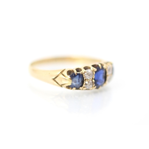 311 - A 19th century untested sapphire and diamond ring, the central cushion cut sapphire with smaller sap... 