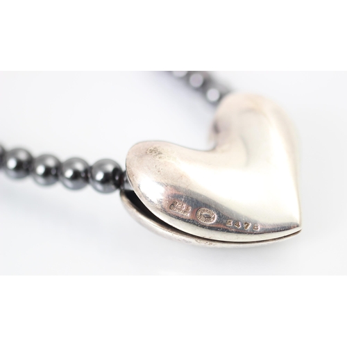 317 - A Georg Jensen silver pendant, the heart shaped pendant stamped 'Georg Jensen 925S Denmark 247B', up... 