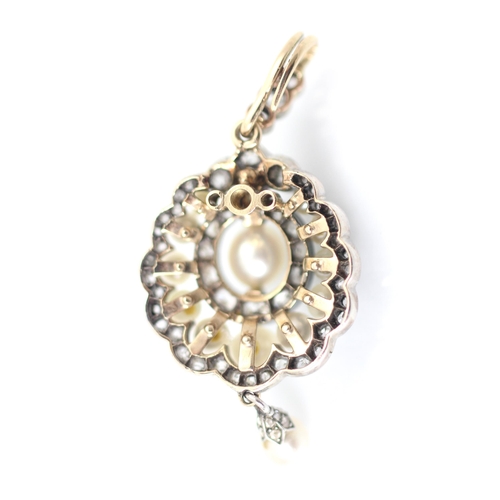 319 - An early 20th century diamond and 'pearl' pendant or brooch, the central 'pearl' surrounded by eleve... 