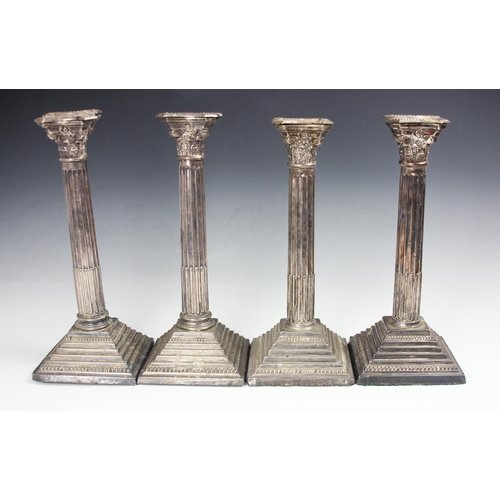 33 - A pair of silver candlesticks, Roberts and Dore Ltd, London 1962, the cast floral terminals above co... 