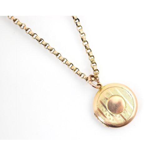 334 - An early 20th century 9ct yellow gold locket pendant, the engine turned decorated circular pendant o... 