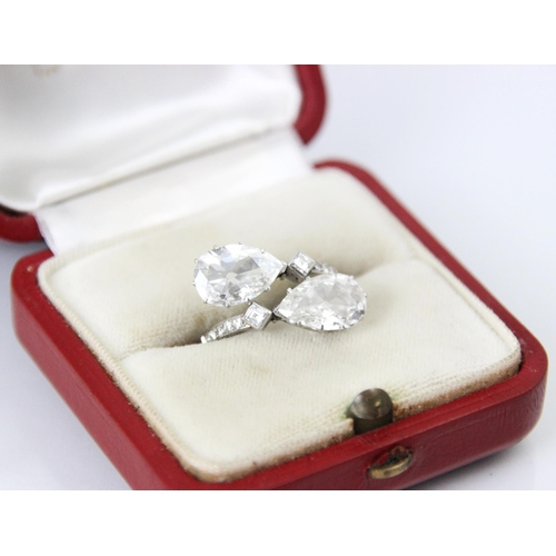 338 - A 20th century old cut pear cut diamond ‘toi et moi’ ring, the two old cut pear cut diamonds claw se... 