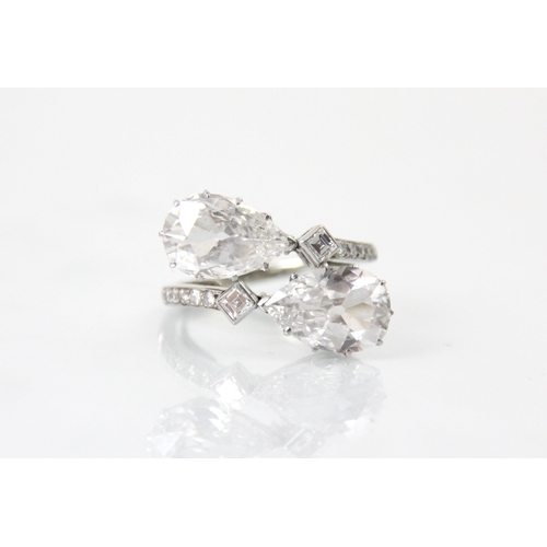 338 - A 20th century old cut pear cut diamond ‘toi et moi’ ring, the two old cut pear cut diamonds claw se... 