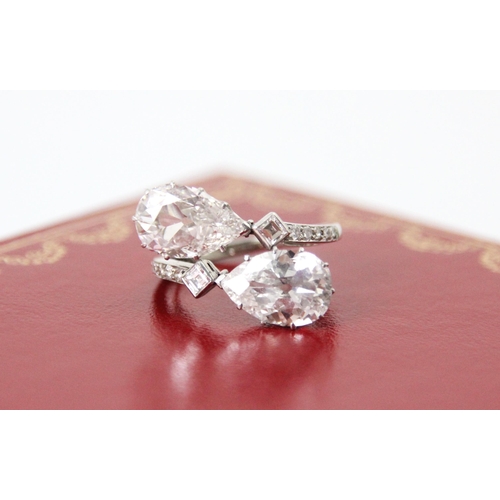 338 - A 20th century old cut pear cut diamond ‘toi et moi’ ring, the two old cut pear cut diamonds claw se... 