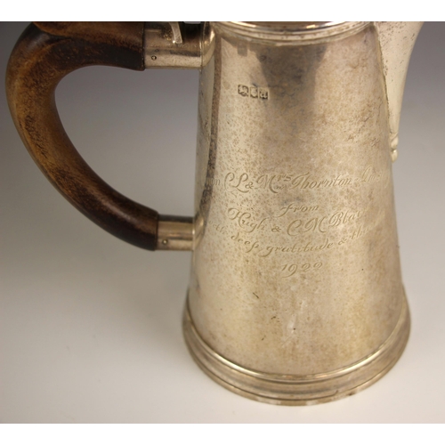 34 - A George V silver coffee pot, Goldsmiths and Silversmiths company, London 1916, of cylindrical form ... 