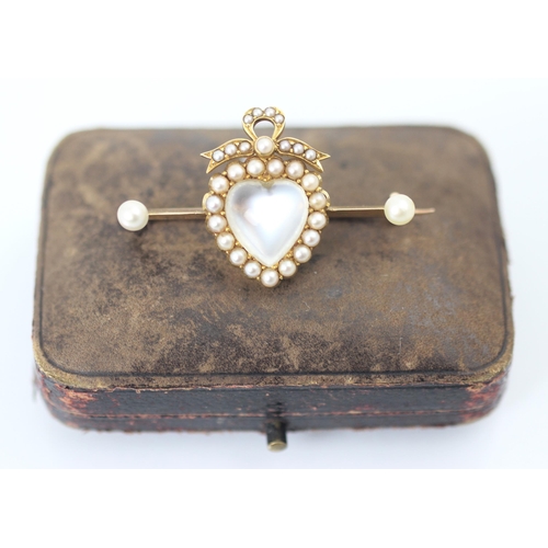 353 - A 19th century style untested moonstone and split pearl locket back brooch, the heart shaped 'moonst... 