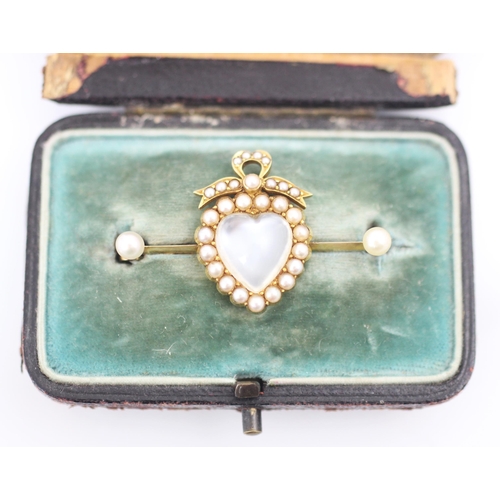 353 - A 19th century style untested moonstone and split pearl locket back brooch, the heart shaped 'moonst... 