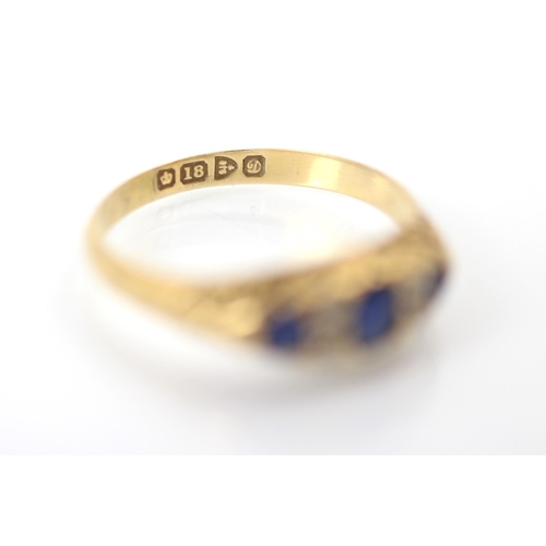 354 - An Edwardian untested sapphire and diamond ring, the central oval cut blue stone with a smaller blue... 