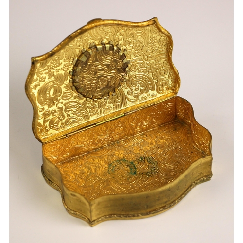 369 - A French gilt metal jewellery casket, 19th century, of serpentine form, the cover inset with a tondo... 