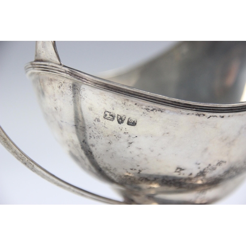 38 - A George V silver sauce boat, possibly S Blanckensee & Son Ltd, Chester 1911, the grooved rim about ... 