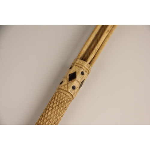 394 - A carved whalebone scrimshaw walking cane, mid 19th century, of gently curved tapering form, the pol... 