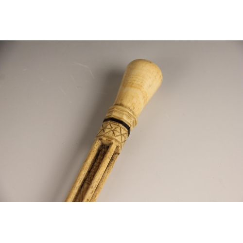 394 - A carved whalebone scrimshaw walking cane, mid 19th century, of gently curved tapering form, the pol... 