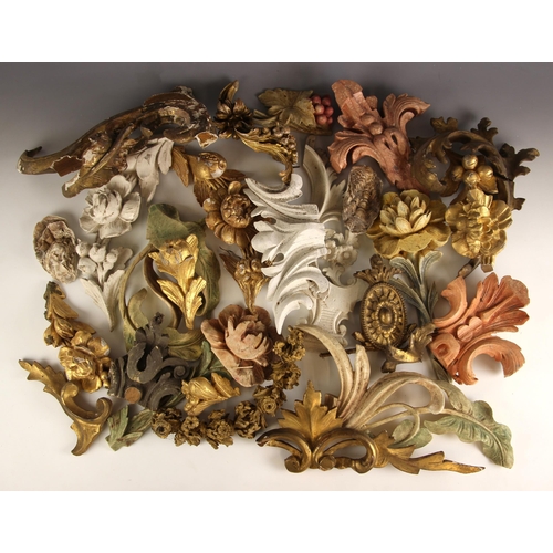 401 - A selection of carved wood and gesso architectural mouldings, to include floral swags and sprays, sc... 