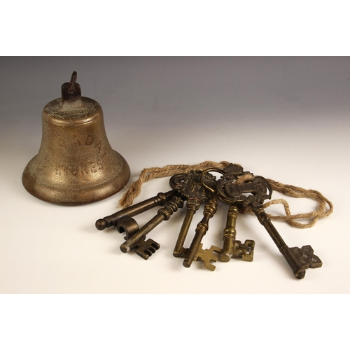 737 - A brass ships bell indistinctly stamped 'Faraday' Widnes', 20cm high, along with a collection of six... 