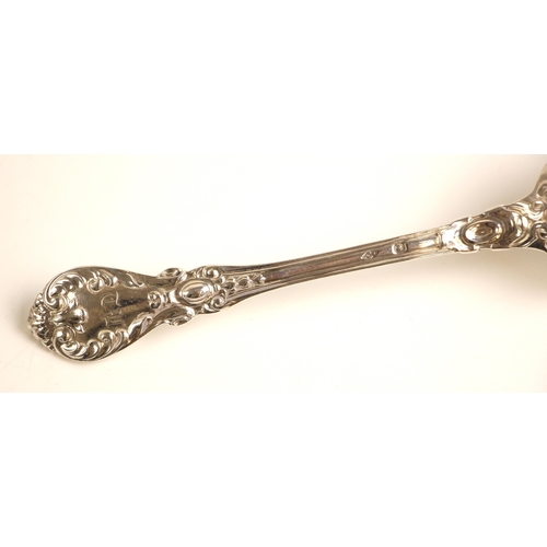 81 - A set of eight 19th century French silver dessert forks, the scrolling decorated spoon with initial ... 