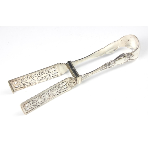 83 - A 19th century French silver asparagus tong, the scrolling decorated handle with pierced floral open... 