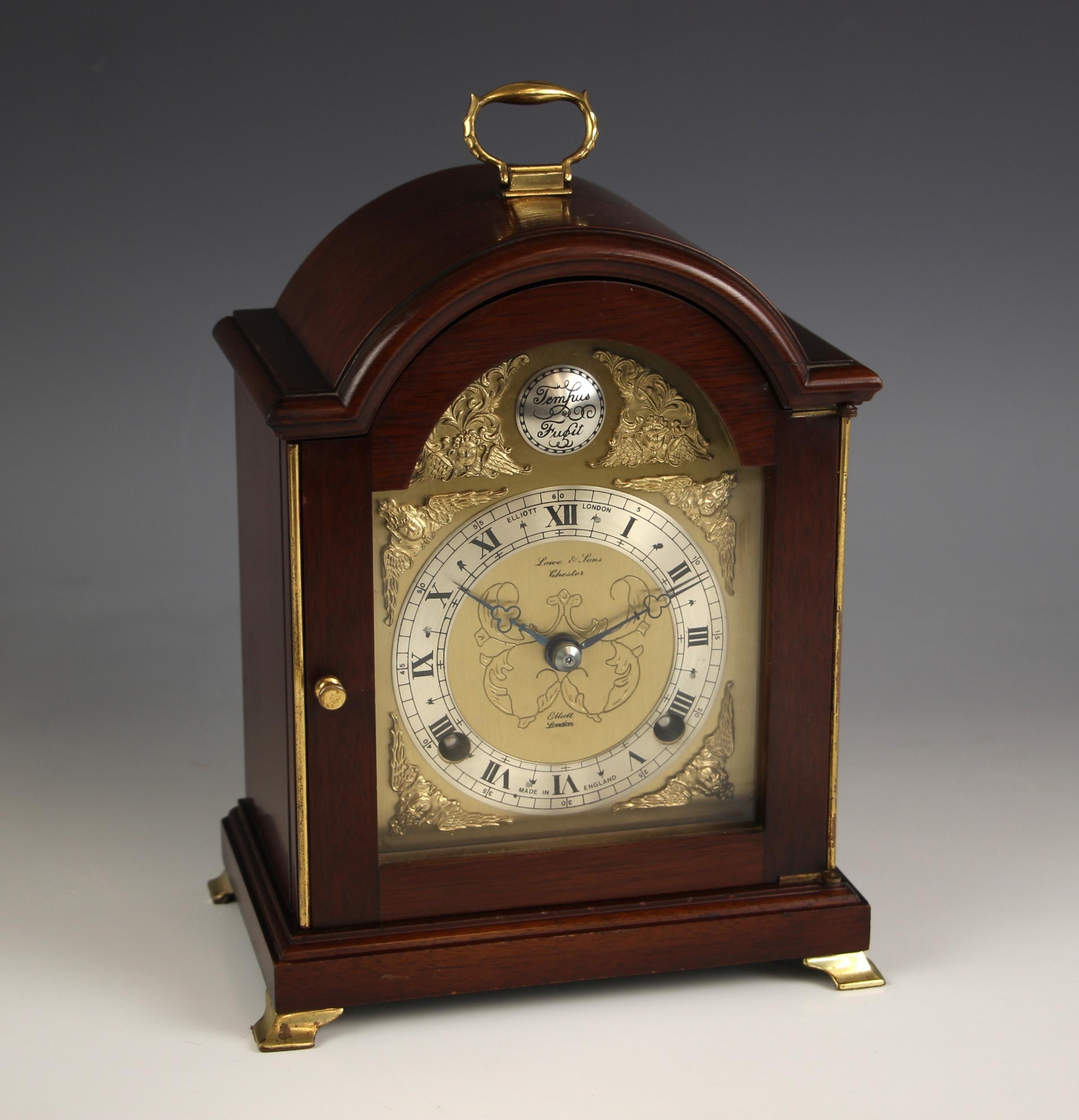 A mahogany cased Elliot mantel clock, retailed by Lowe and Sons