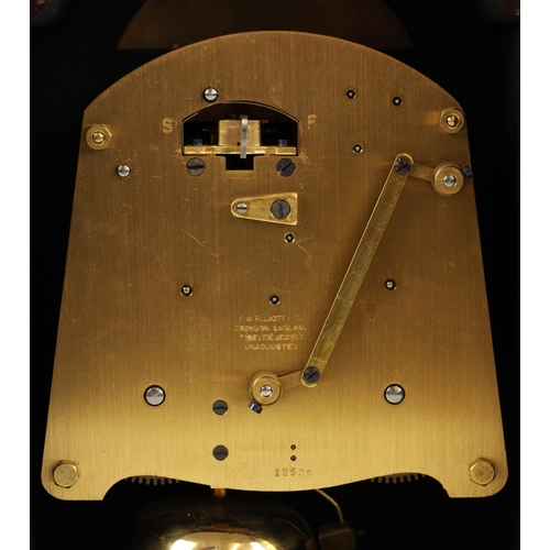 A mahogany cased Elliot mantel clock, retailed by Lowe and Sons, Chester, the arched case enclosing