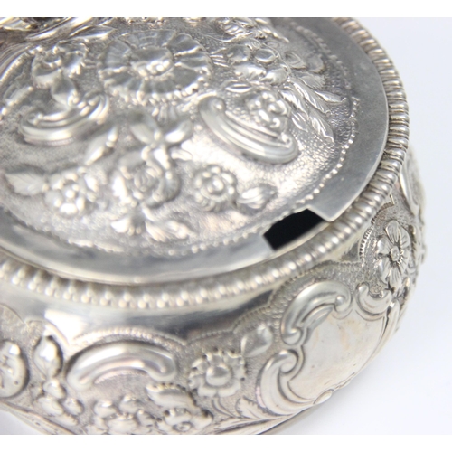 87 - A George III silver wet mustard, JE Terry and Co, London 1820, the circular florally embossed hinged... 