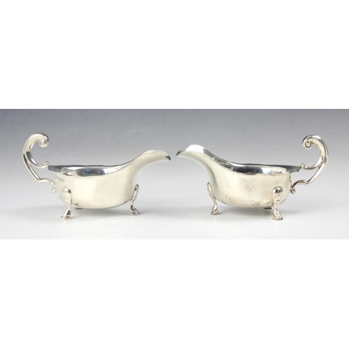 93 - A pair of George V silver sauce boats, Viner’s Ltd, Sheffield 1932, the scroll flying handles above ... 