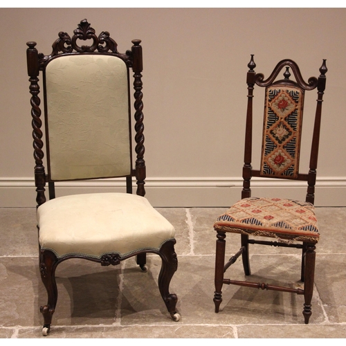 988 - A Victorian carved walnut bedroom chair, the 'C' scroll open work crest above a padded back and barl... 