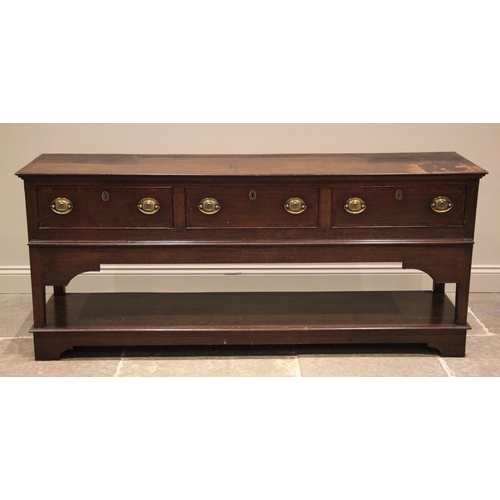 990 - A George III and later oak and mahogany crossbanded Montgomery dresser, the high back with a moulded... 