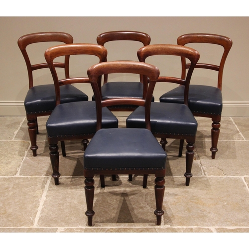 996 - A matched set of twelve Victorian mahogany buckle back dining chairs, each with a straight front pad... 