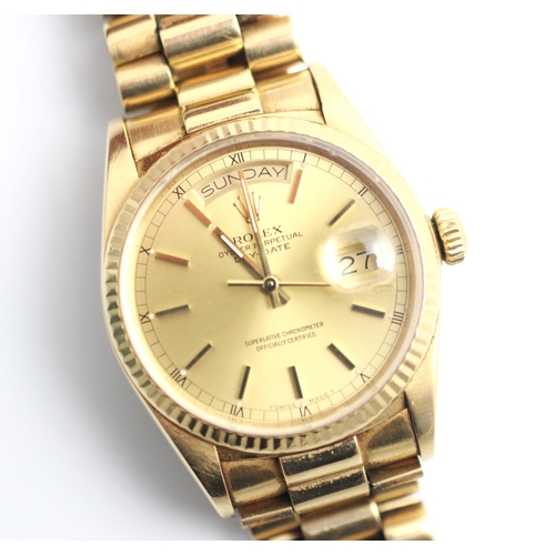 189 - A gentleman's 18ct gold Rolex Oyster Perpetual Day-Date wristwatch, the round gold-toned dial with b... 