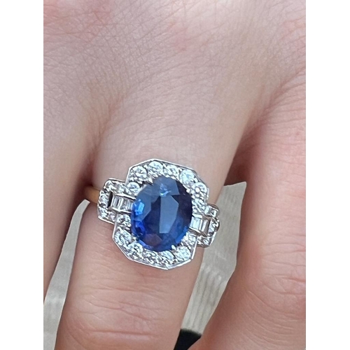 330 - An Art Deco style sapphire and diamond cluster ring, the central oval cut sapphire within octagonal ... 