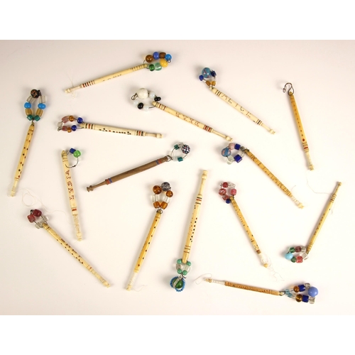 368 - A collection of bone sweetheart lace bobbins, 19th century and later, each with carved decoration an... 