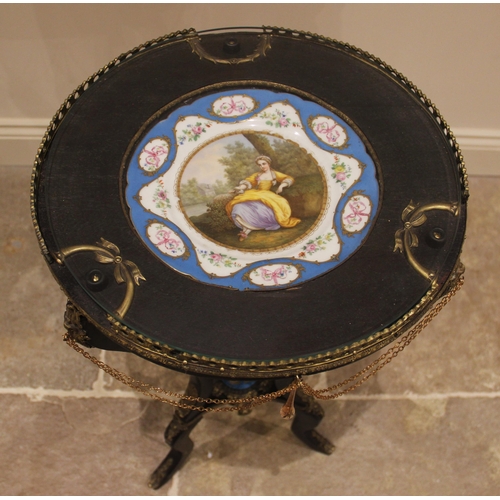 382 - A French ebonised Sevres inset gueridon, the circular top inset with a glazed panel over a Sevres pl... 