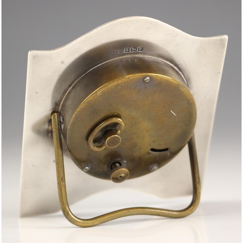 8 - A George V silver bedside timepiece, possibly James Geraghty, Birmingham 1930, the engine turned det... 