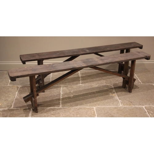 1023 - A near pair of pine benches, early 20th century, of rectangular form upon trestle type supports, 52c... 