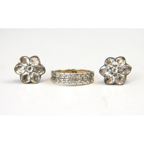 218 - A diamond set double half eternity ring, the rows of round cut stones set within spitch set white me... 