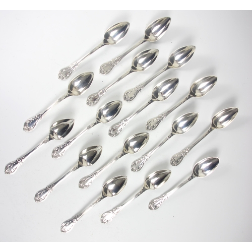 78 - A set of sixteen 19th century French silver teaspoons, the scrolling decorated spoon with initial to... 