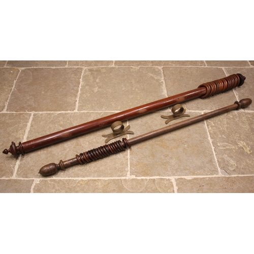 994 - A Victorian mahogany curtain pole, of typical cylindrical form, with turned finials and wooden curta... 