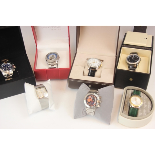 197 - A selection of vintage boxed watches, including an Ellesse watch, upon a green leather style strap, ... 