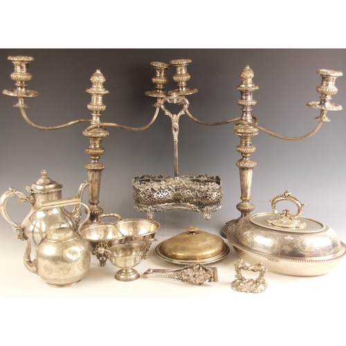 160 - A selection of silver plate and silver items, including a large pair of candelabra, the three urn sh... 