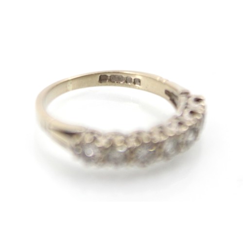 268A - A late 20th century 18ct white gold diamond half eternity ring, the seven round cut diamonds within ... 