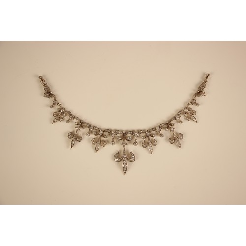 245 - A late 19th/early 20th century diamond set tiara converting to necklace, the central fleur-de-lys mo... 