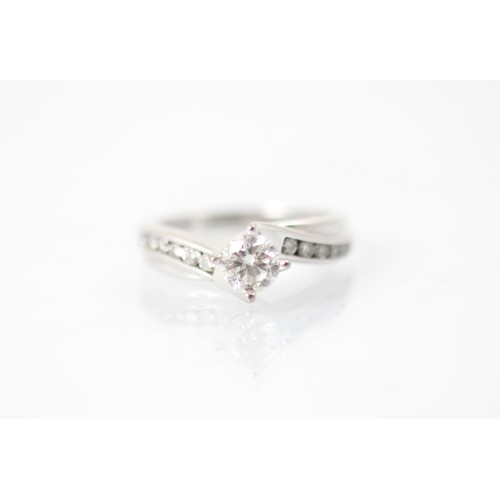 227A - A late 20th century diamond solitaire ring, the round cut diamond in white metal claw setting with s... 