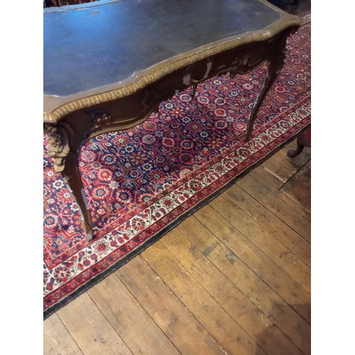 987 - An Italian carved wood and gesso bureau plat, 18th/19th century, the shaped top inset with a skiver,... 