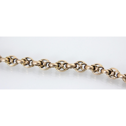 101 - A 19th century yellow metal bracelet, the circular links enclosing two smaller circular links, suspe... 